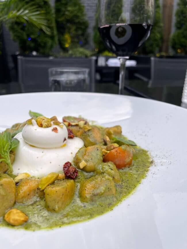 Creamy burrata with vibrant basil pesto and crunchy pistachios.