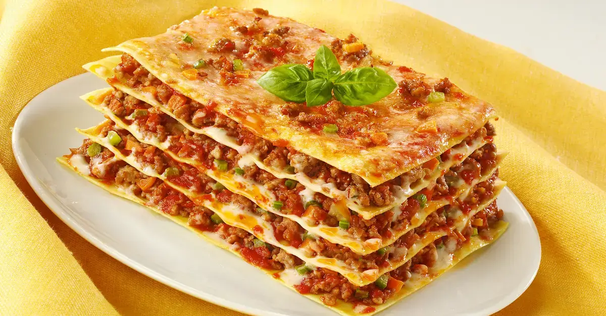  Italian meat lasagna layered with pasta sheets, rich tomato sauce, seasoned ground meat, and melted cheese for a hearty comfort dish.