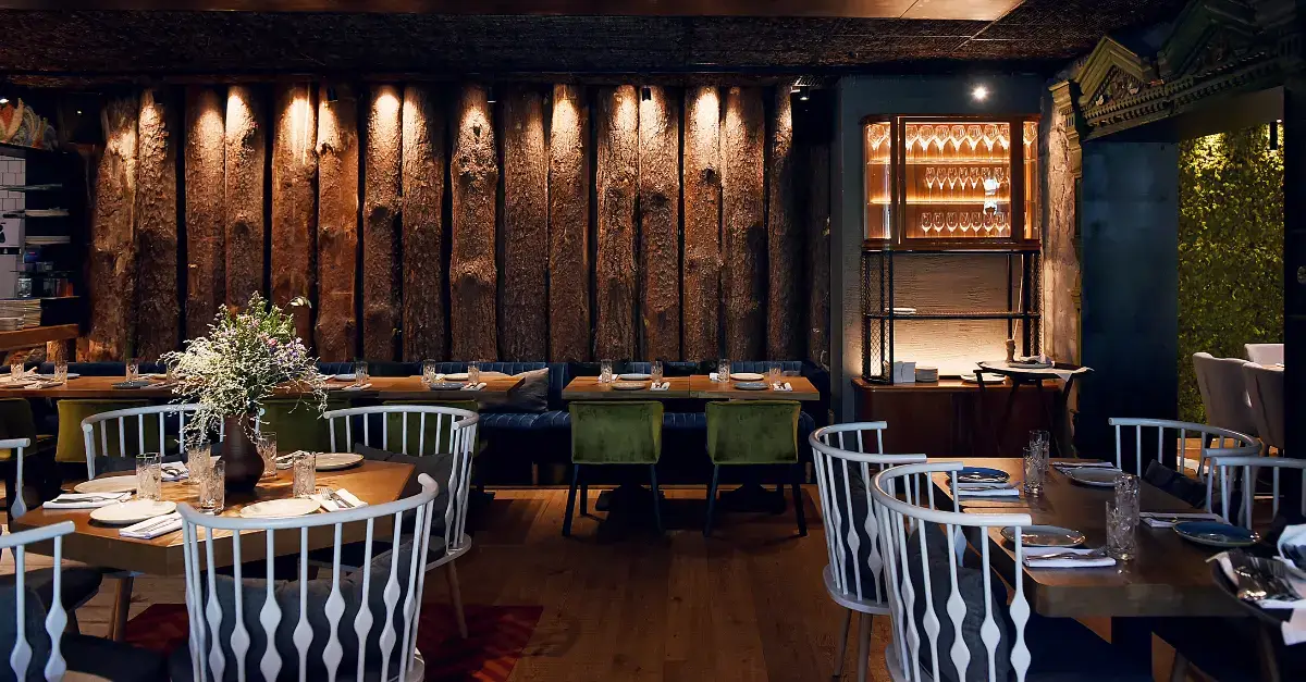 Cozy and stylish dining room at Blu Ristorante on King Street West Toronto with wooden accents and warm lighting.