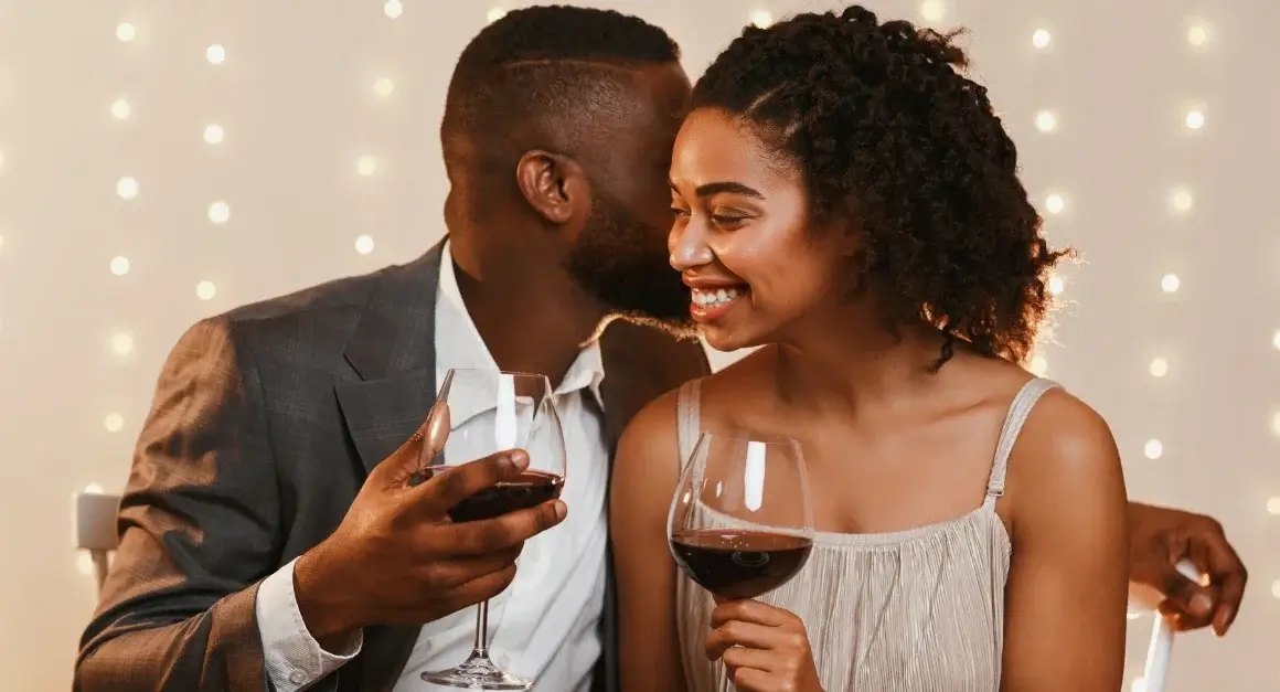 Couple enjoying wine at romantic Toronto restaurant